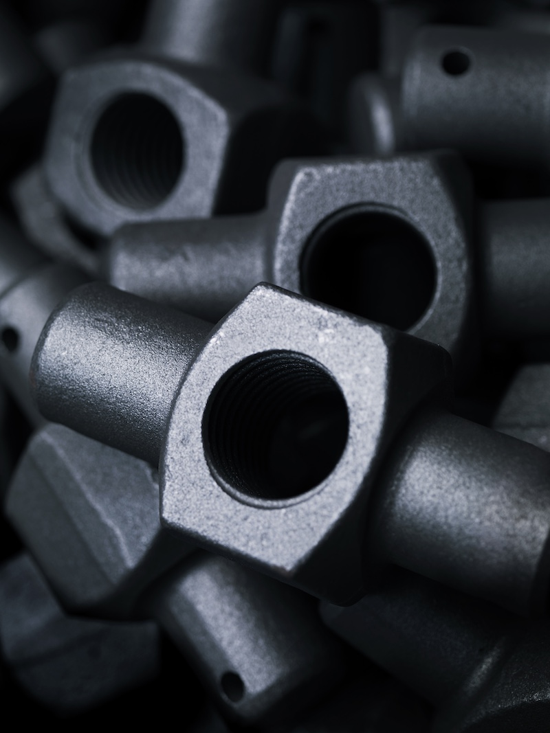 Drilled and machined trunnions for railway freight coupling units